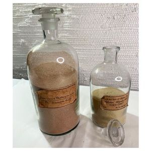 Set of Two French Style Glass Apothecary Bottles with glass stoppers.